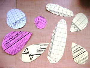 Thin cardboard templates of insect wings, bodies and heads